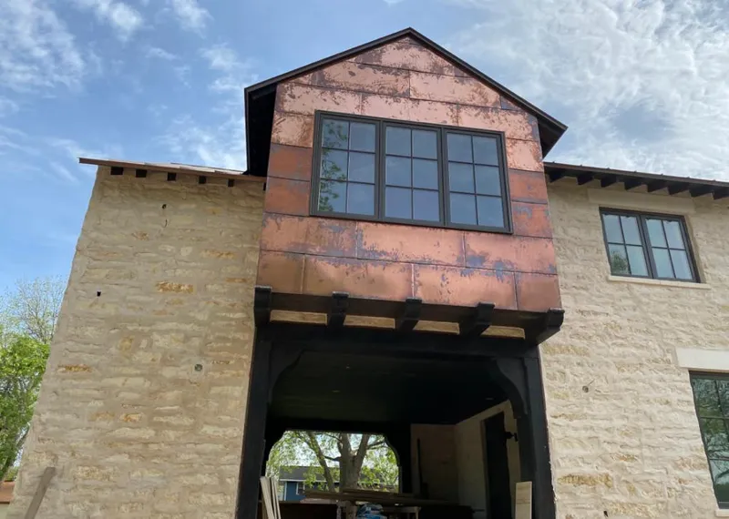 Copper metal panel facade on a stone building for Skylight Installation in Healdsburg